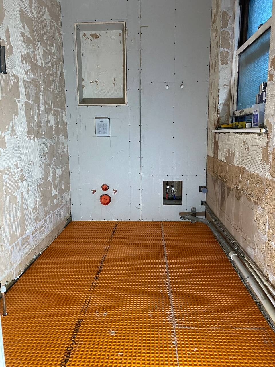 Bathroom walls boarded and prepared for tiling